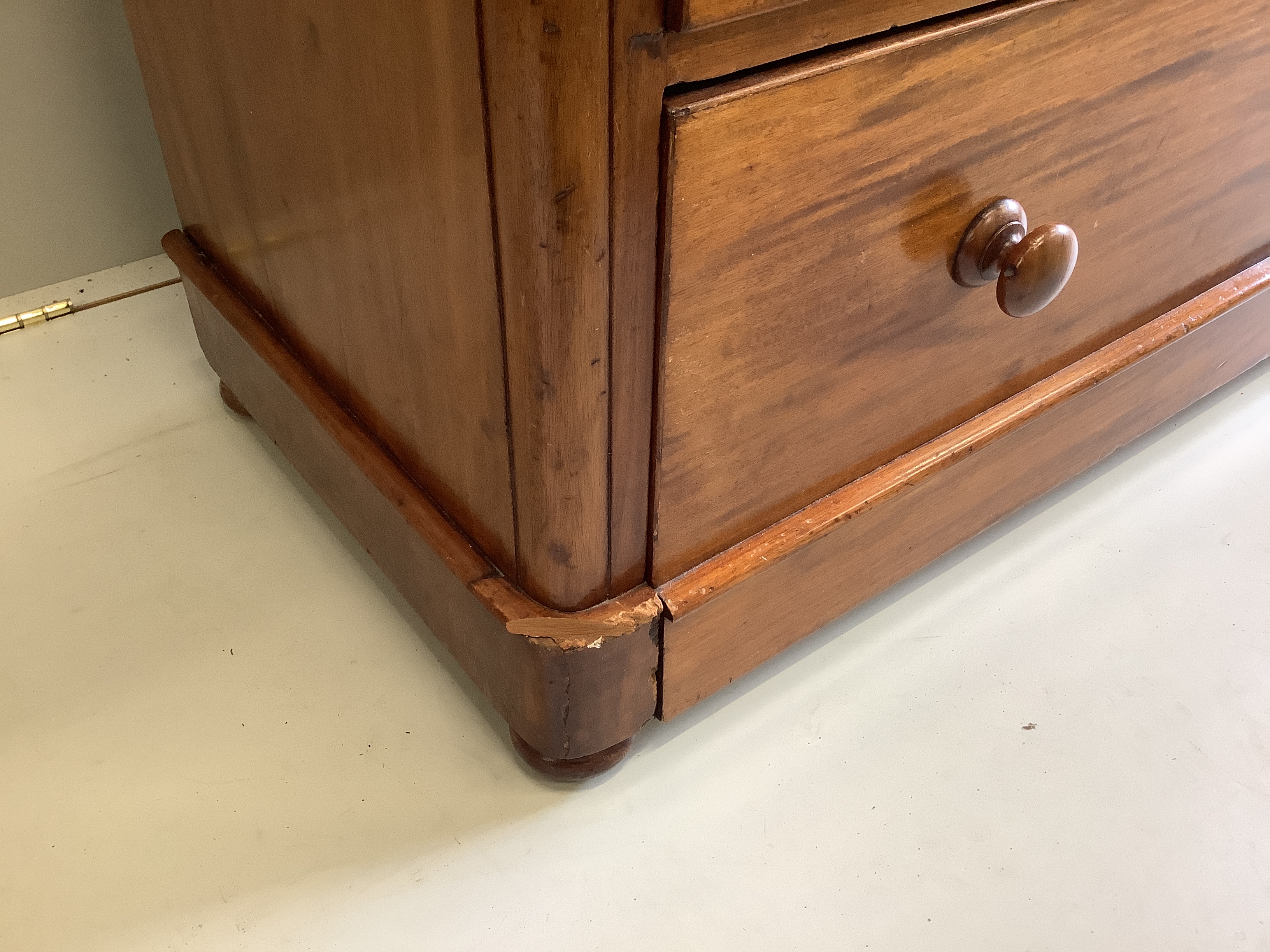 A Victorian mahogany chest of two short and three long drawers, fitted with turned mahogany handles, width 106cm, depth 51cm, height 106cm